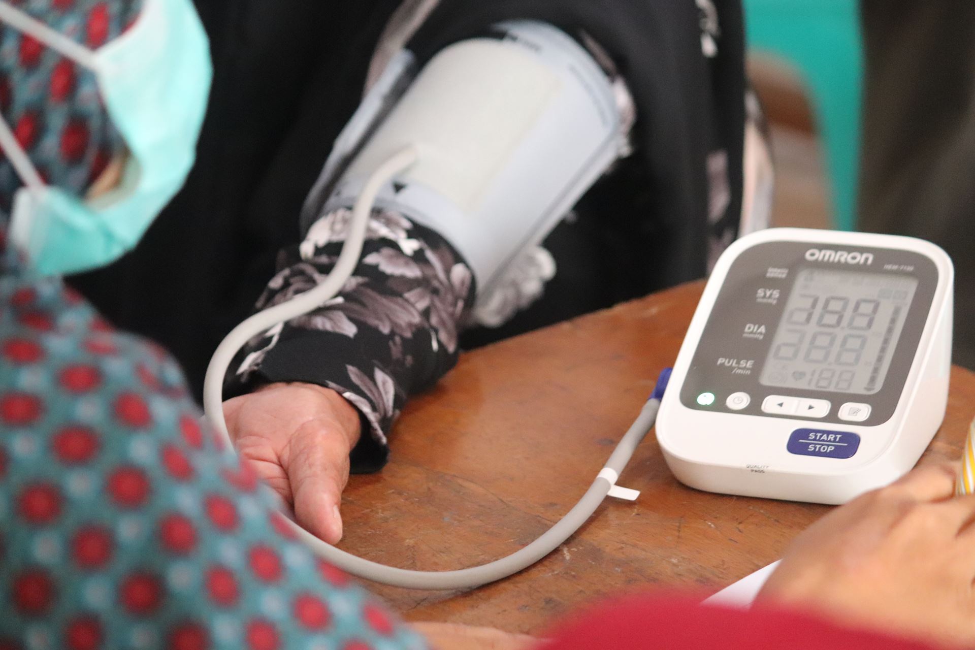 A person having their blood pressure taken
